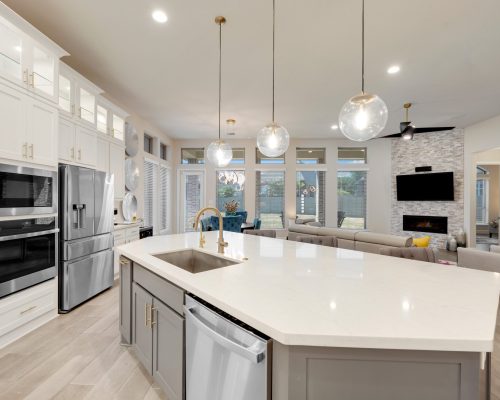 A,White,Kitchen,With,A,Granite,Island